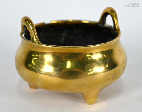 A small 19th century Chinese brass tripod censer,