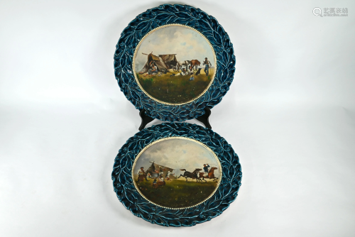 A pair of large Continental majolica chargers
