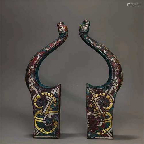 A PAIR OF WARRING STATES INLAYING GOLD AND SILVER BOW HOLDER...