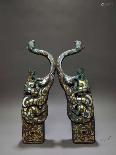 A PAIR OF WARRING STATES INLAYING GOLD AND SILVER BOW HOLDER...