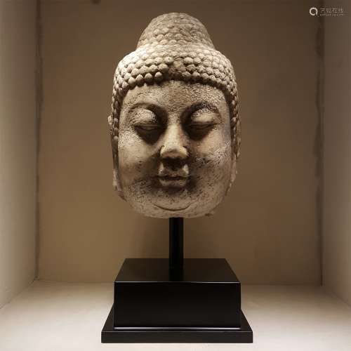 A STONE BUDDHA HEAD