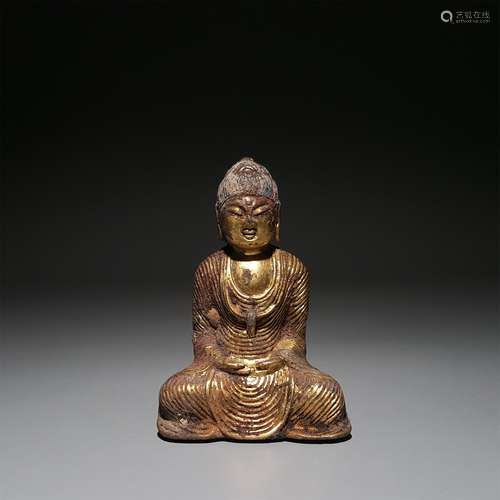 A GILT BRONZE SAKYAMUNI