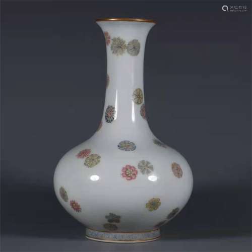 A QING DYNASTY YONGZHENG FAMILLE ROSE BALL FLOWER ORNAMENTAL...