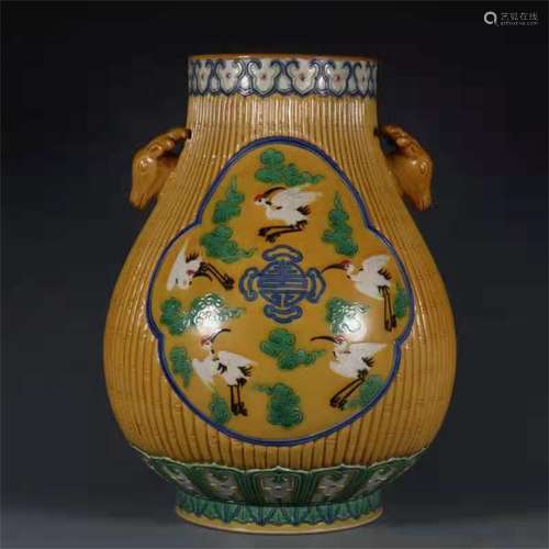 A QING DYNASTY QIANLONG YELLOW GLAZE THREE COLOR CRANE PATTE...