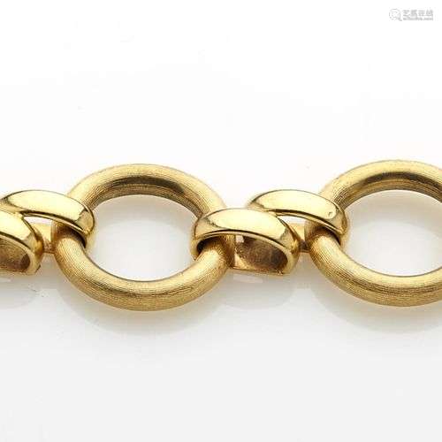 Bracelet souple en or jaune composé d'anneaux ronds satinés ...
