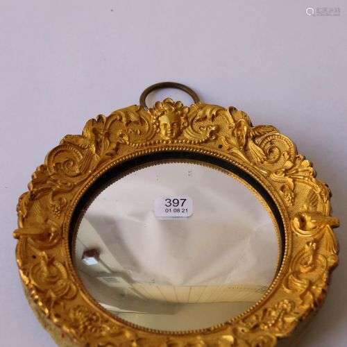 Petit miroir sorcière de forme ronde, encadrement en bronze ...