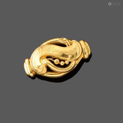 Broche volute, XIXe siècle. En or jaune 18k ajouré et partie...