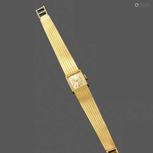 Bracelet montre de dame. Vers 1960. En or jaune 18k, le boit...