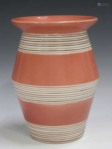 A Clarice Cliff Bizarre vase, 1930s, the salmon pink body wi...