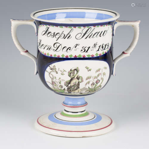 A pearlware loving cup, dated 1812, the cobalt blue ground U...