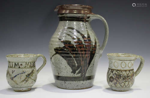 Two Elizabeth Roussel studio pottery mugs, both commemoratin...