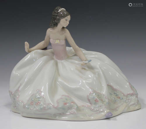 A Lladro figure At the Ball, No. 5859, boxed.Buyer’s Premium...