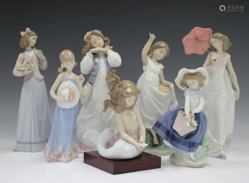 Seven Lladro figures, comprising Afternoon Promenade, No. 76...