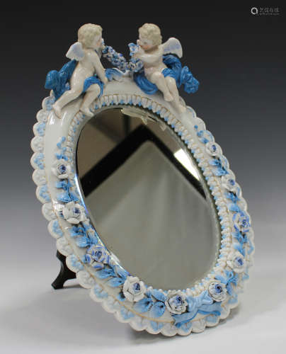 A Continental porcelain oval mirror frame, late 19th/early 2...