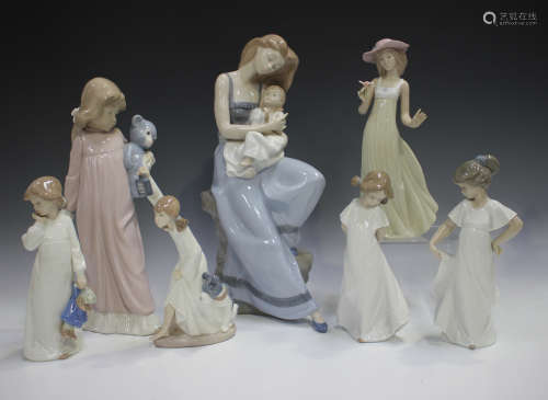 Four Lladro figures, including Chit Chat, No. 5466, together...