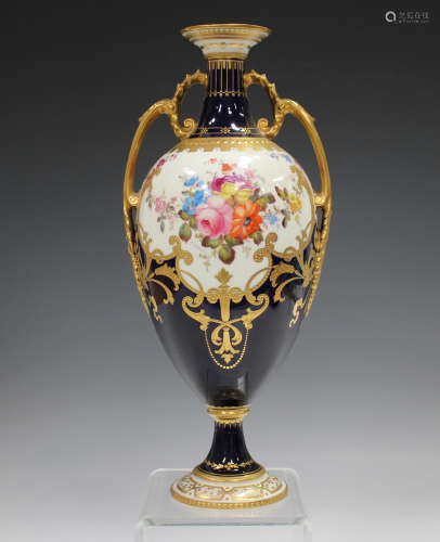 A Royal Crown Derby two-handled cobalt blue ground vase, cir...
