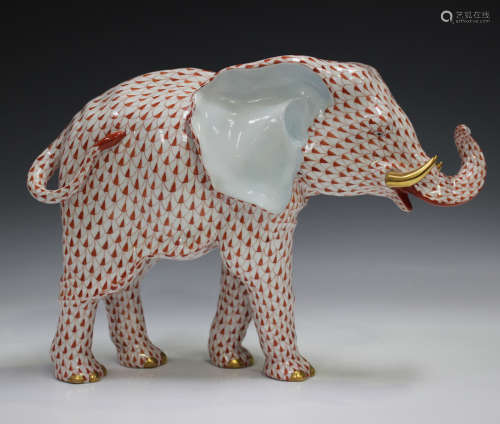 A large Herend porcelain elephant with iron red scale decora...