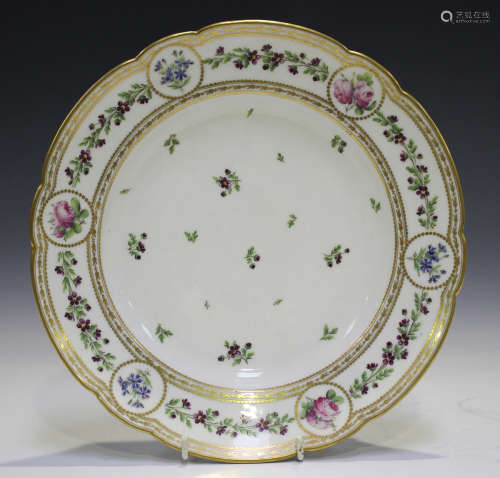 A French porcelain circular dish, late 19th century, painted...