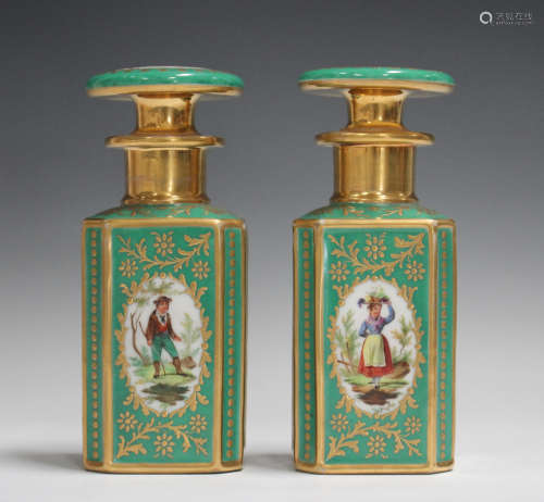 A pair of French porcelain green ground scent bottles and st...