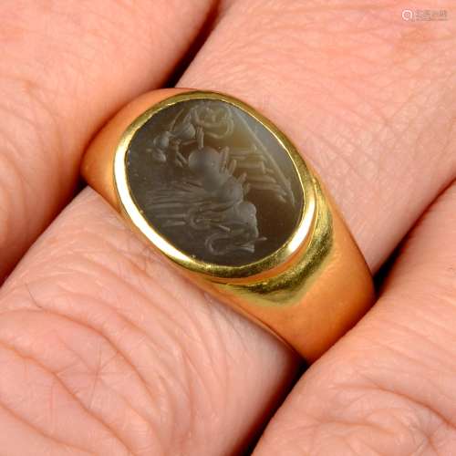 An agate intaglio signet ring, carved to depict Apollo ridin...