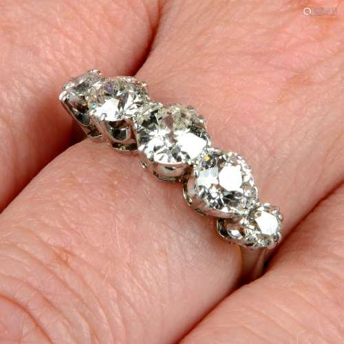 A graduated circular-cut diamond five-stone ring.