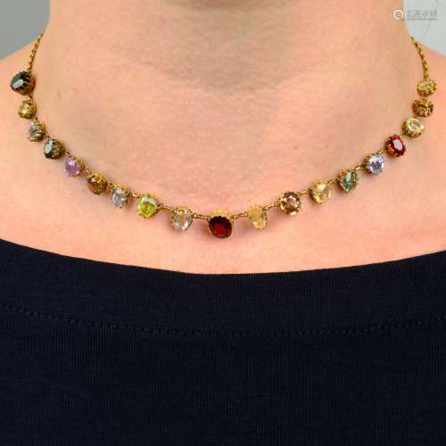 An early 20th century gold multi-gem necklace.