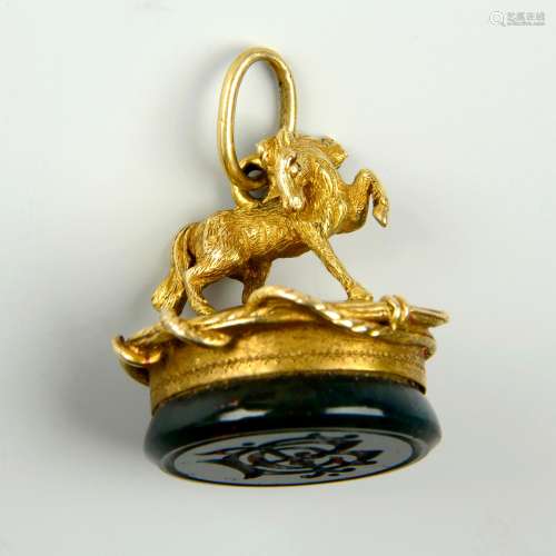 A Victorian gold bloodstone seal, with figural horse and enc...