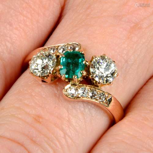 An emerald and circular-cut diamond three-stone ring,