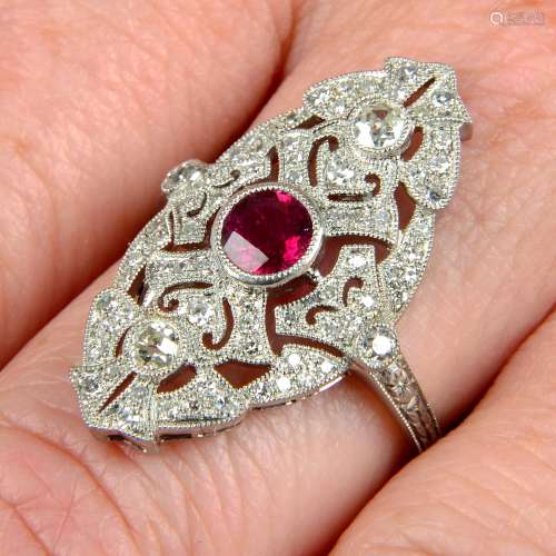 A ruby and diamond openwork dress ring.Ruby weight 0.46ct.To...