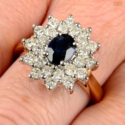 An 18ct gold sapphire and diamond cluster ring.