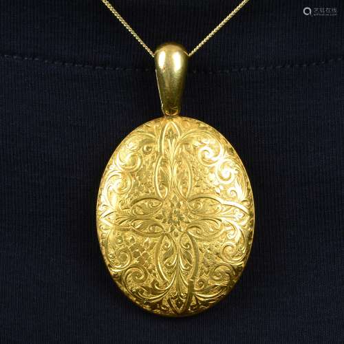 A late Victorian 18ct gold floral engraved locket.