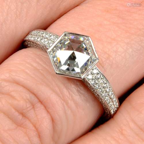 A platinum hexagonal-cut diamond single-stone ring,