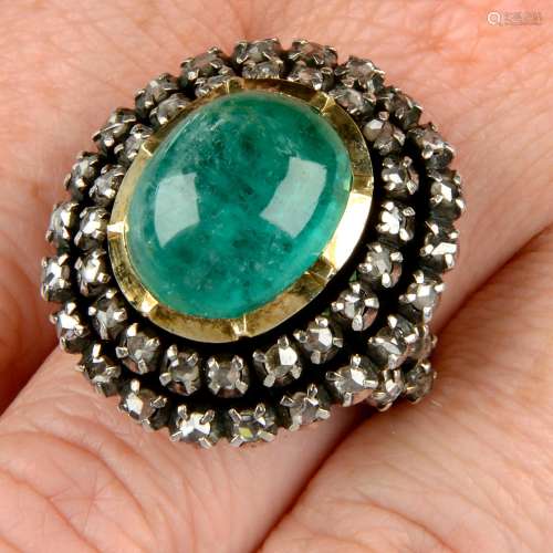 An emerald cabochon and rose-cut diamond cluster ring.