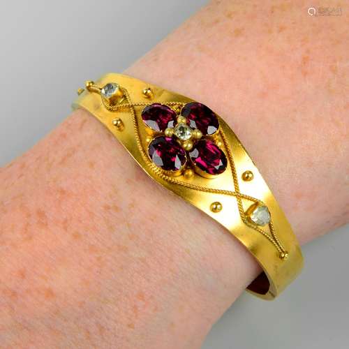 A late 19th century gold, garnet and chrysoberyl hinged bang...