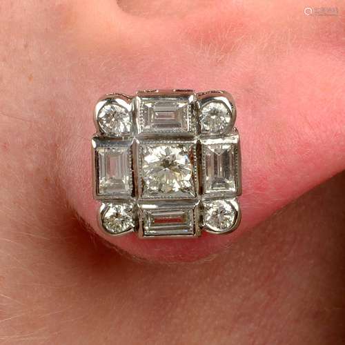 A pair of brilliant and baguette-cut diamond square-shape ea...