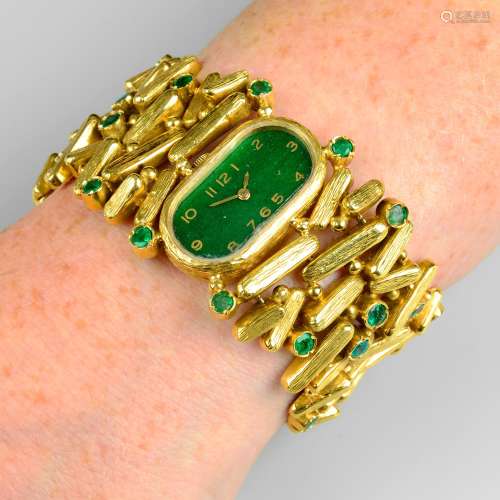 A 1970s 18ct gold emerald cocktail watch, with painted green...