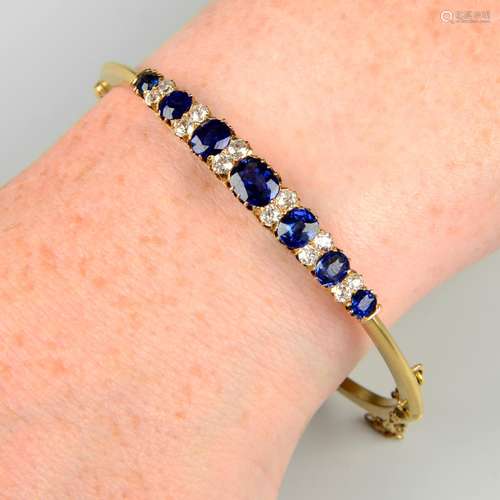 An early 20th century gold sapphire and old-cut diamond hing...