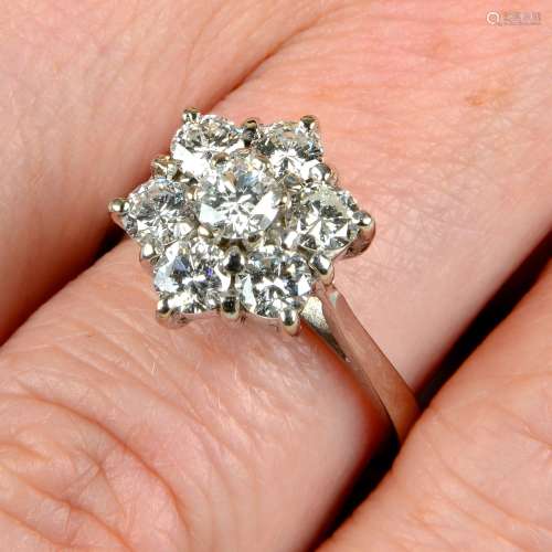 A brilliant-cut diamond floral cluster ring.Estimated total ...