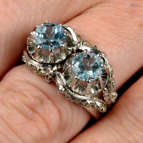 A mid 20th century gold aquamarine two-stone dress ring,