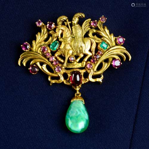 A garnet, emerald and glass brooch, depicting a warrior on h...