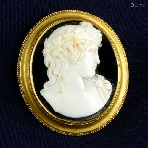 A late Victorian gold onyx and shell cameo brooch, depicting...