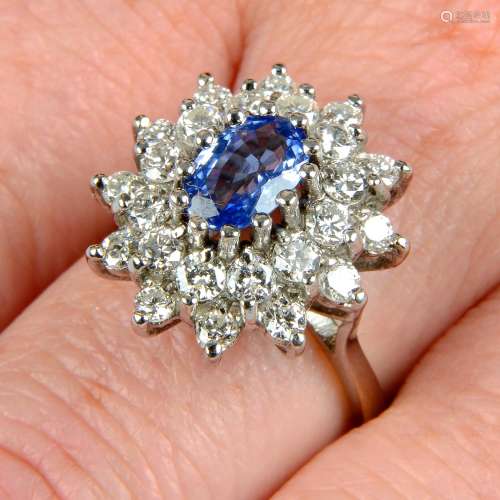 A sapphire and diamond cluster ring.Sapphire calculated weig...