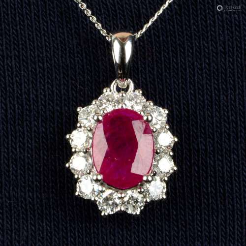 An 18ct gold ruby and brilliant-cut diamond cluster pendant,