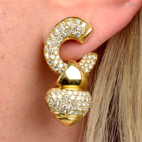 A pair of pavé-set diamond hoop earrings,