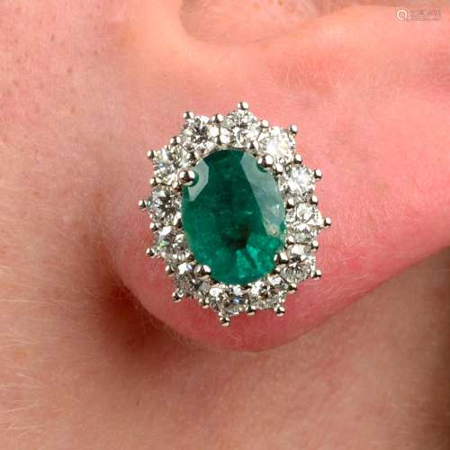 A pair of 18ct gold emerald and brilliant-cut diamond cluste...