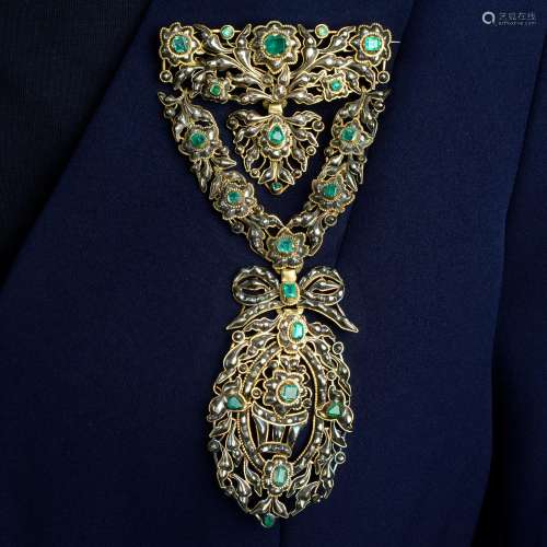 An emerald and rose-cut diamond stomacher brooch.