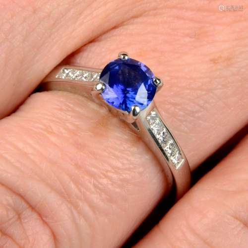 A sapphire single-stone ring, with square-shape diamond line...
