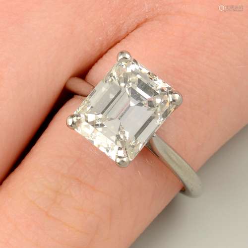 A platinum rectangular-shape diamond single-stone ring.