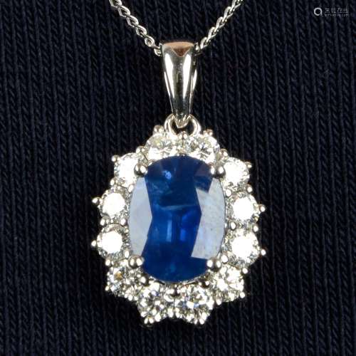 An 18ct gold sapphire and brilliant-cut diamond cluster pend...