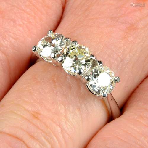 A platinum old-cut diamond three-stone ring.Estimated total ...